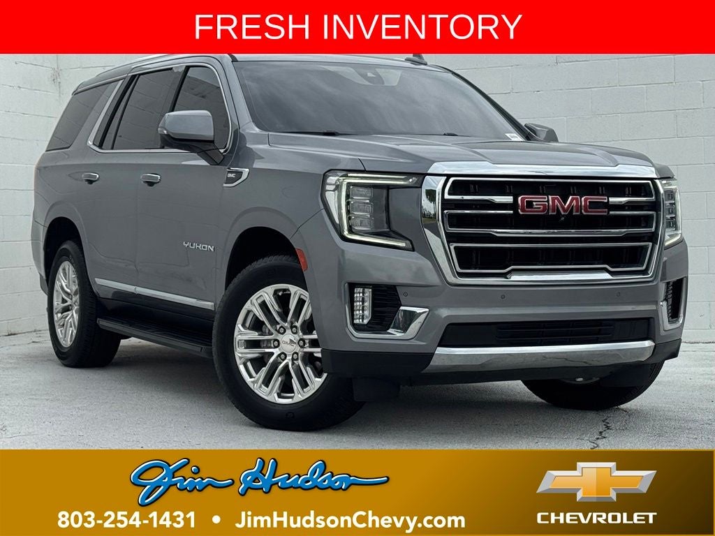 2022 GMC Yukon SLT in Steel Metallic — front three-quarter view