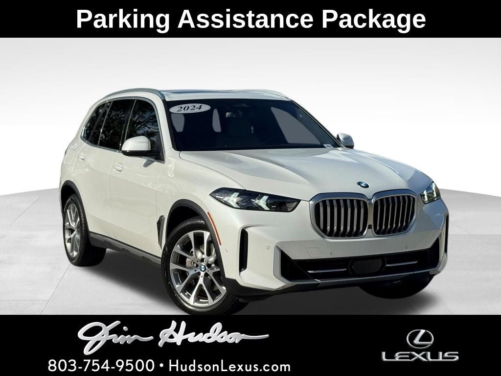 2024 BMW X5 xDrive40i Premium Climate Parking Assistance Package in Mineral White Metallic — front three-quarter view